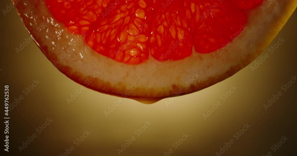 Water or juice drops falling from juicy fresh pulp of grape fruit. Organic grapefuit rich in vitamins used for lemonade or detox drinks close up 4k footage Water or juice drops falling from juicy fresh pulp of grape fruit. Organic grapefuit rich in vitamins used for lemonade or detox drinks close up 4k footage