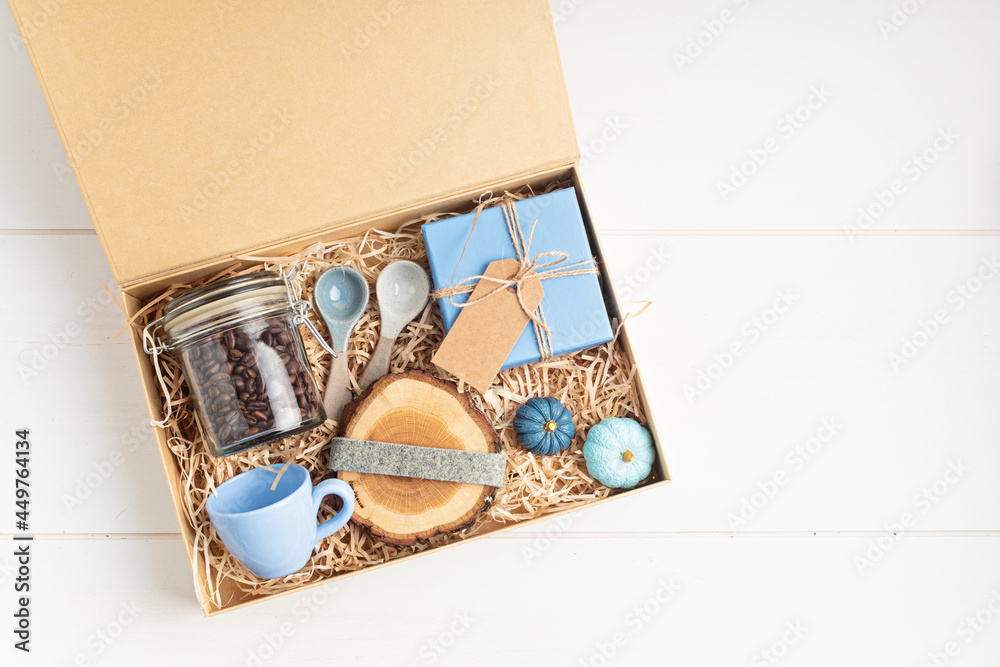 Preparing care package, seasonal gift box for coffee lovers. Personalized  eco friendly basket for family and friends for christmas, thanksgiving,  mothers day Stock Photo | Adobe Stock