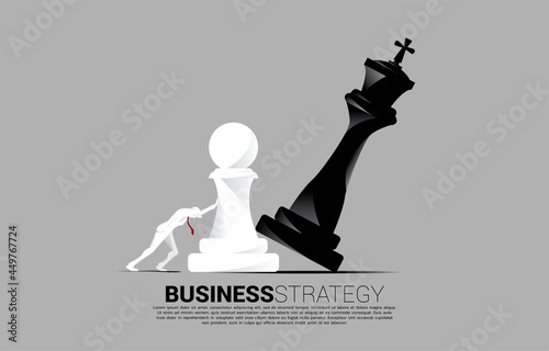 Silhouette of businessman push pawn chess piece to checkmate the king. concept of business strategy and marketing plan disruption