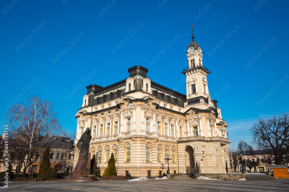 Poland, Lesser Poland, Nowy Sacz, Town hall at town square with sculptured monument Poland, Lesser Poland, Nowy Sacz, Town hall at town square with sculptured monument