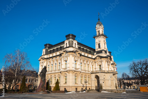 Poland, Lesser Poland, Nowy Sacz, Town hall at town square with sculptured monument photo