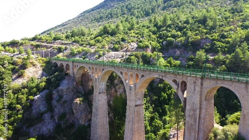 The Varda Viaduct, aka Giaour Dere Viaduct, locally known as Alman Köprüsü, is a railway viaduct situated at Hacıkırı village in Karaisalı district of Adana Province in southern Turkey. photo