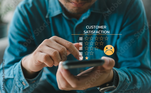 Customer Experience dissatisfied Concept, Unhappy Businessman Client with Sadness Emotion Face on smartphone screen, Bad review, bad service dislike bad quality, low rating, social media not good.