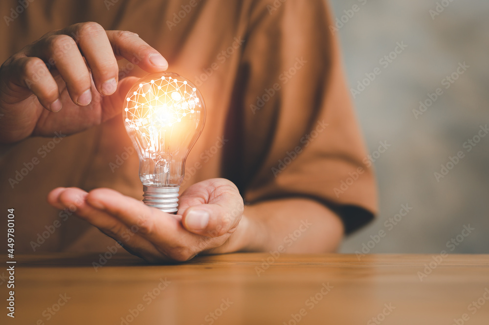 Innovation. Hands holding light bulb for Concept new idea concept with innovation and inspiration, innovative technology in science and communication concept. - obrazy, fototapety, plakaty 