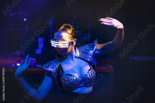 dancersshowing techno dance performance in disco and nightclub