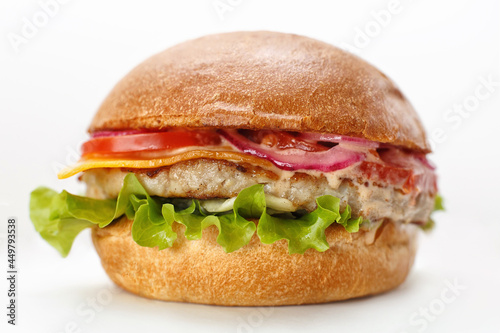 fresh cheeseburger with tomato and beef on white background