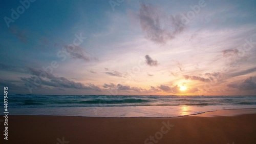 4K Beautiful tropical beach with sunset sky. Beautiful Phuket beach is famous tourist destination at Andaman sea summer concept. Areal drone view tropical beach with sunset over the sea