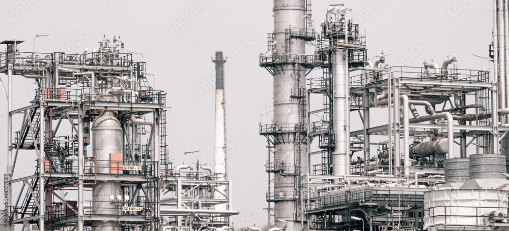 Industrial zone,The equipment of oil refining,Close-up of industrial pipelines of an oil-refinery plant,Detail of oil pipeline with valves in large oil refinery. Industrial zone,The equipment of oil refining,Close-up of industrial pipelines of an oil-refinery plant,Detail of oil pipeline with valves in large oil refinery.