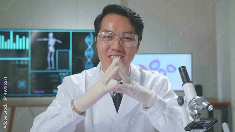 Asian Scientist Researching In The Laboratory With A Microscope And Speaking To The Camera
Asian Scientist Researching In The Laboratory With A Microscope And Speaking To The Camera