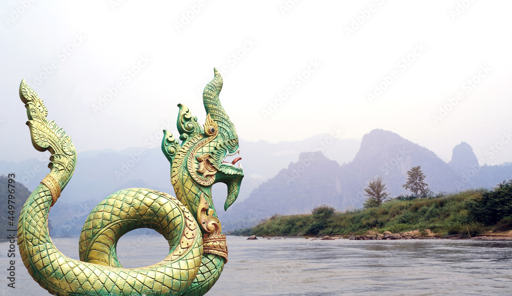Statue of mythical asian naga snake and landscape with mountains and river Mekong - obrazy, fototapety, plakaty 