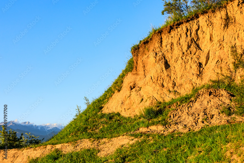 Soil mountain nature scenery at dusk in Xinjiang. Soil mountain nature scenery at dusk in Xinjiang.