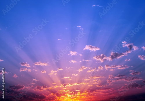 a landscape with the sun's rays in the sky at sunset