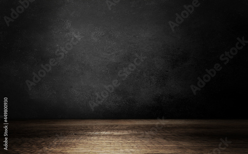 Wooden table and black wall background