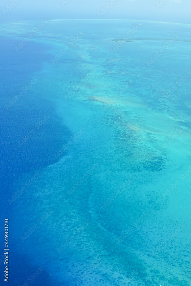 The Caribbean Sea with a beautiful blue gradation seen from the sky