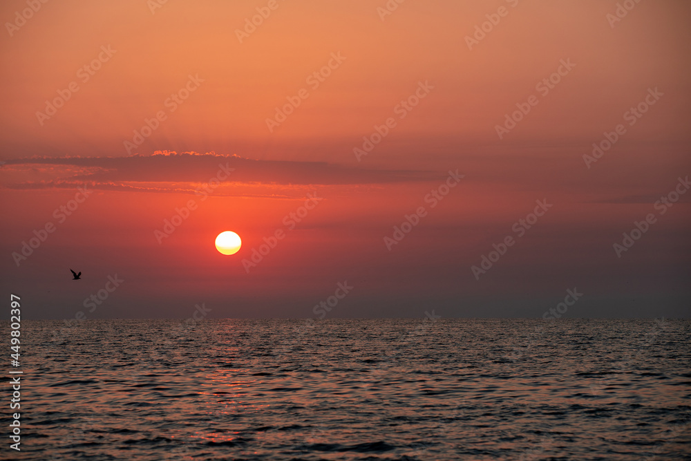 a sunrise seen from the beach