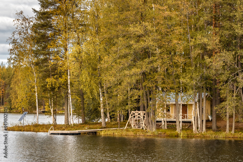 Canvastavla Small island on the lake with a country house in Finland.