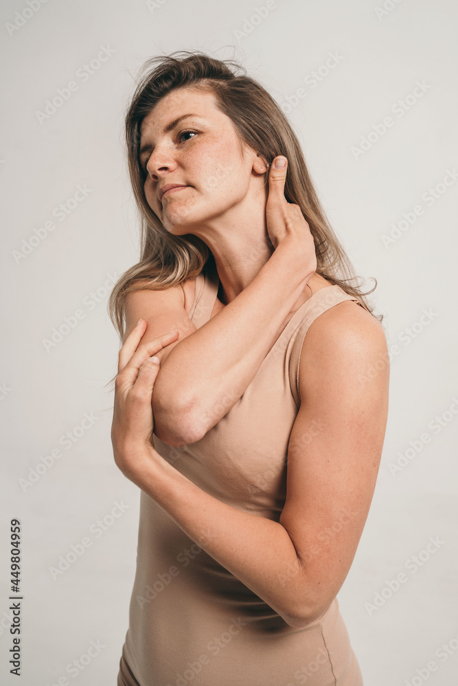 A girl in beige underwear. Natural and natural beauty. Minimalism in clothes and make-up. A top view of the girl. Photo shoot of a girl in the studio. A girl in beige underwear. Natural and natural beauty. Minimalism in clothes and make-up. A top view of the girl. Photo shoot of a girl in the studio.
