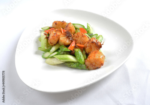 stir fried scallop with vegetables in spicy samba xo chilli sauce seafood in white background asian halal menu