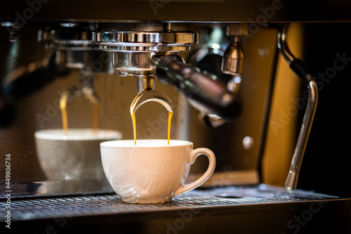 Grinding coffee beans and making coffee in a Café in Melbourne. photo