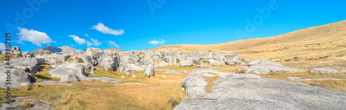panoramic view of Castle Hill on sunshine day. Majestic limestone rock formations at Castle Hill, Canterbury, South Island of New Zealand.