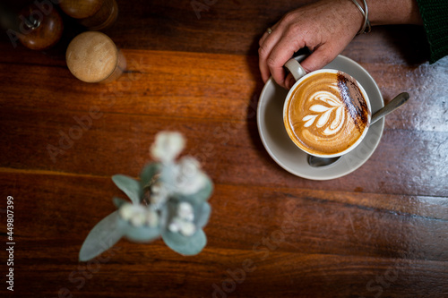 Canvas Print Hot steaming almond milk coffee being make in Australia.