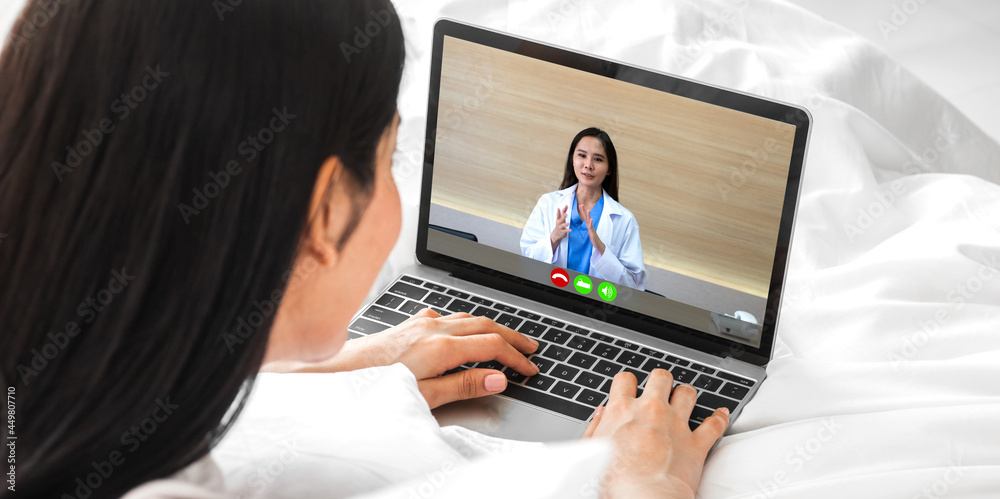 Woman talk speak using laptop computer and video conference online with doctor and stethoscope service help support team discussing and consulting talk video chat call checkup information at home Woman talk speak using laptop computer and video conference online with doctor and stethoscope service help support team discussing and consulting talk video chat call checkup information at home