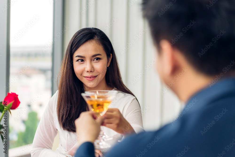 Romantic young happy asian couple relax talking celebrate together in valentine day at the restaurant Romantic young happy asian couple relax talking celebrate together in valentine day at the restaurant