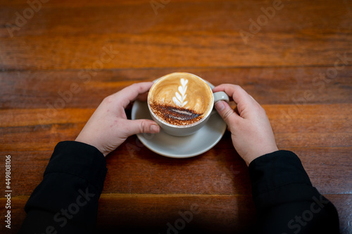 A Barista making coffee in a cafe, in New york. photo