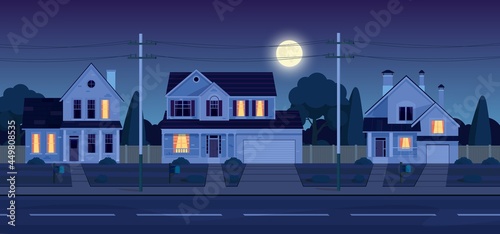 Street in suburb district with houses at night