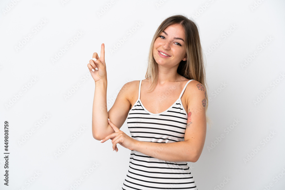 Young Romanian woman isolated on white background happy and pointing up Young Romanian woman isolated on white background happy and pointing up