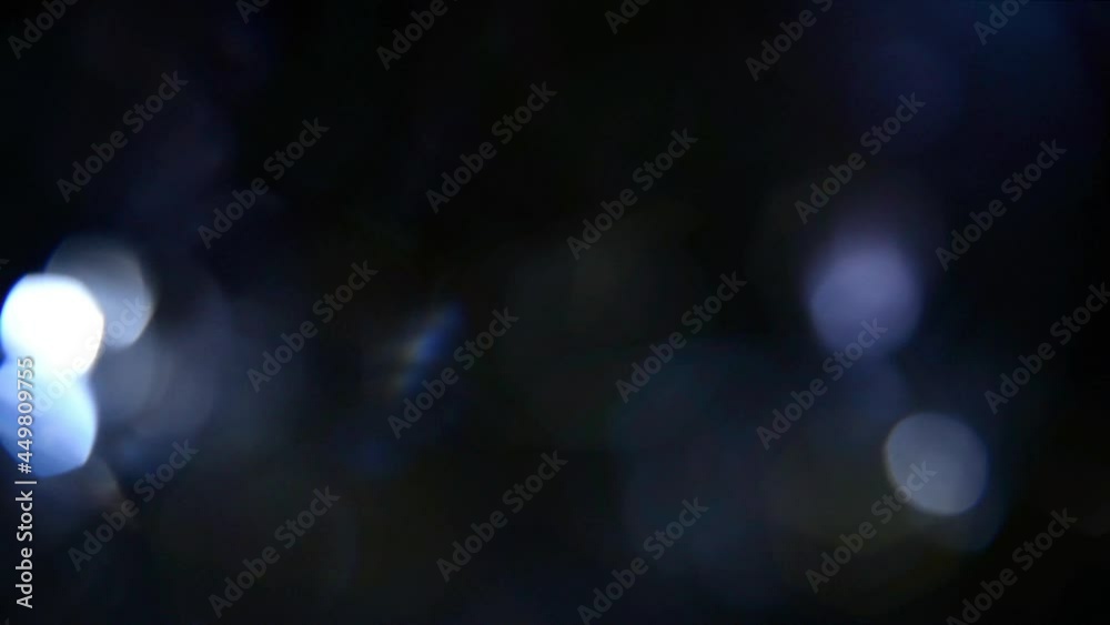 This motion stock graphic features elegant blue bokeh from optical highlights.