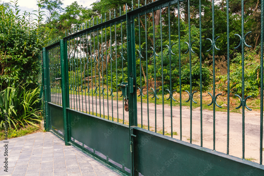 Old metal entrance gate to private property. Old metal entrance gate to private property.
