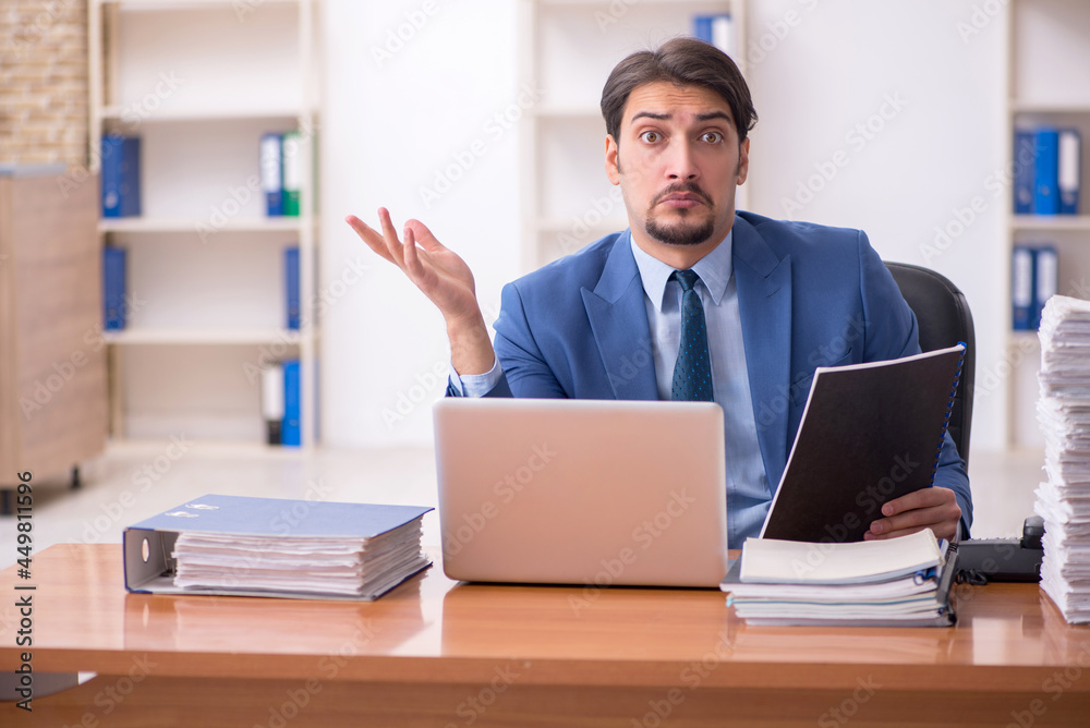 Young businessman employee working in the office Young businessman employee working in the office