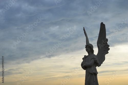 Statue of an angel and sky