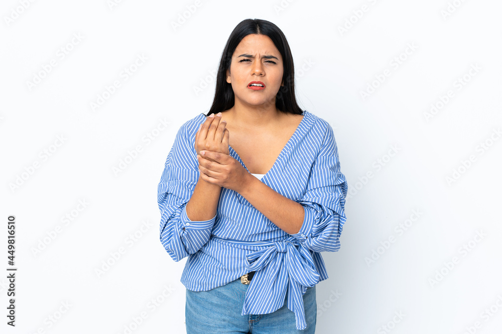 Young latin woman woman isolated on white background suffering from pain in hands Young latin woman woman isolated on white background suffering from pain in hands