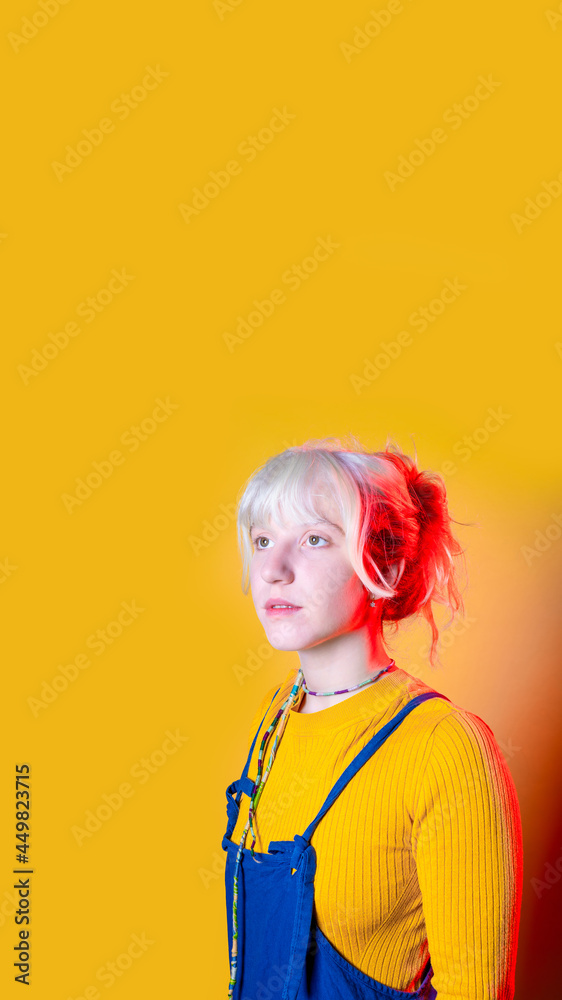 young caucasian woman isolated posing looking away pensive and dreaming on copyspace background vertical banner