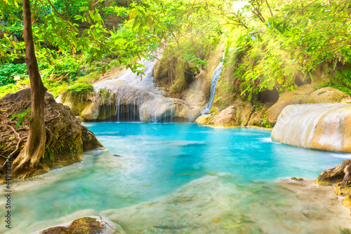 Tropical landscape with beautiful waterfall  emerald lake and rocks in wild jungle forest. Erawan National park  Kanchanaburi  Thailand