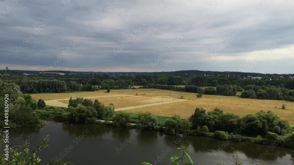 View over the valley of the river Ruhr in Mülheim an der Ruhr. Grey sky, some wind. Summer. No people View over the valley of the river Ruhr in Mülheim an der Ruhr. Grey sky, some wind. Summer. No people