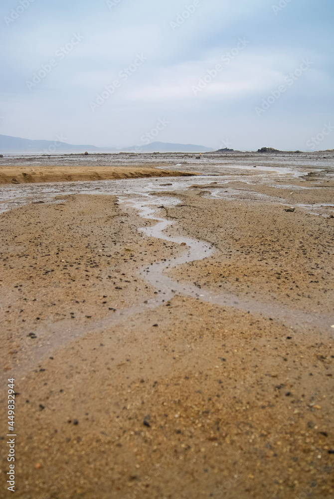 Cloudy skies and mudflats in the West Sea of Korea Cloudy skies and mudflats in the West Sea of Korea