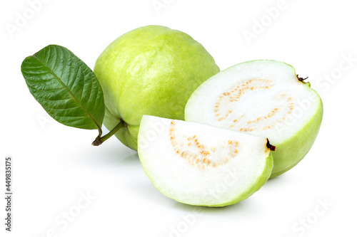 Guava fruit with green leaf and cut in half sliced isolated on white background.