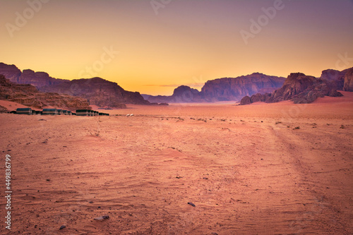 Dramatic Wadi Rum Jordanian desert scene during sunset.