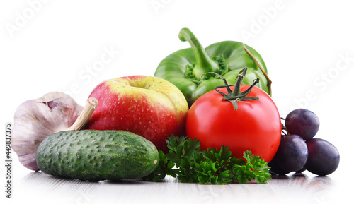 Composition with fresh vegetables and fruits isolated on white