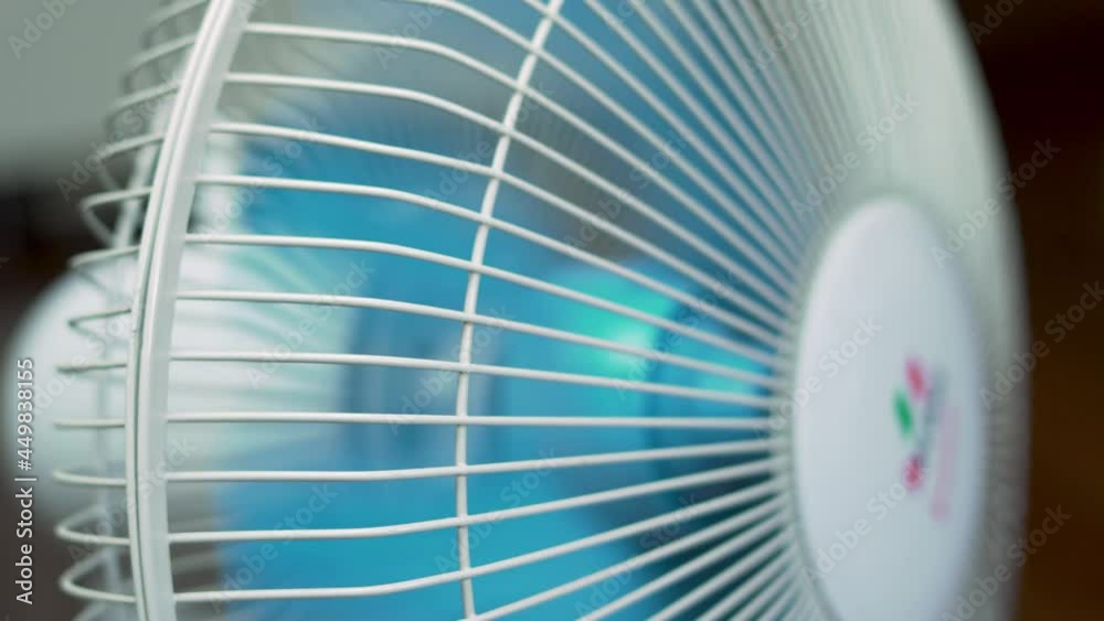 Macro Fan Operation. The Fan Blades Rotate on A Hot Day. Macro Fan Operation. The Fan Blades Rotate on A Hot Day.
