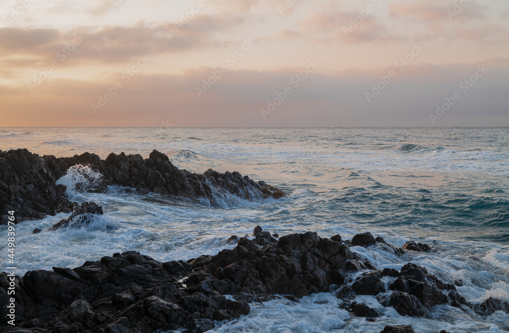 Landscape of rock formation in Barronal beach in Cabo de Gata nature park, Spain, during sunrise