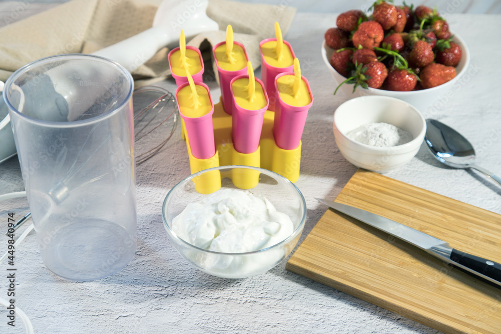 Ingredients for making homemade ice cream with strawberries. Home cooking Ingredients for making homemade ice cream with strawberries. Home cooking