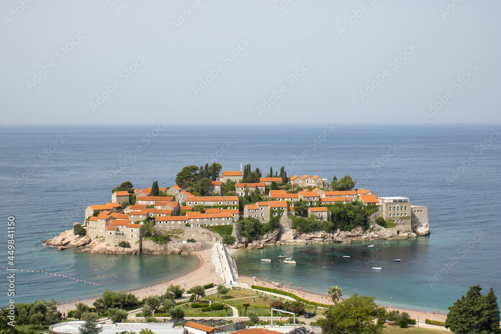 Top view of Sveti Stefan island. Details of architecture in the old town. Hotel of millionaires in the Mediterranean.