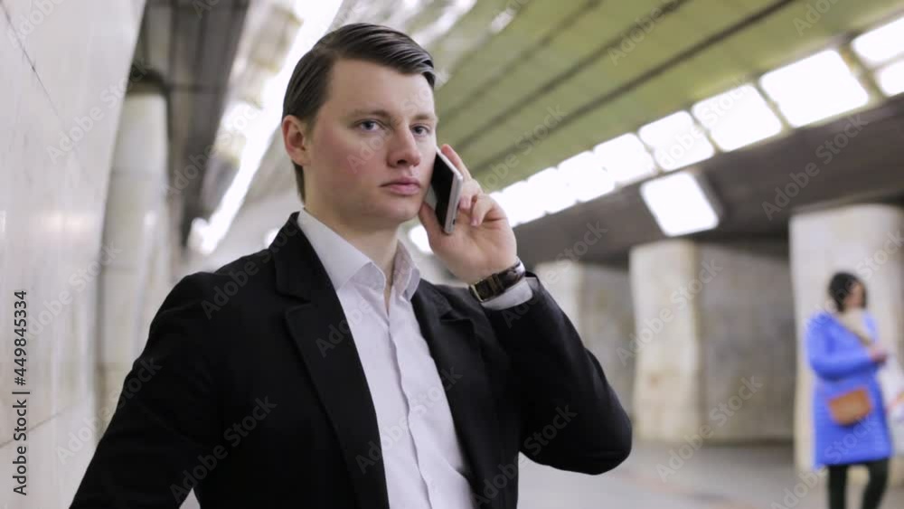 Handsome young guy is calling on the phone. Handsome young guy is calling on the phone.