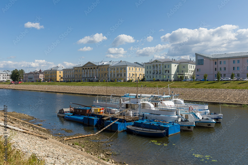 Naklejka premium View on the river bank in Vologda. Boats in foreground.