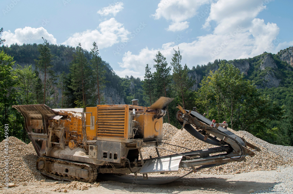 Fototapeta premium Old small mobile stone crusher crawler machine