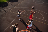 Overhead view of african american man playing basketball with friends